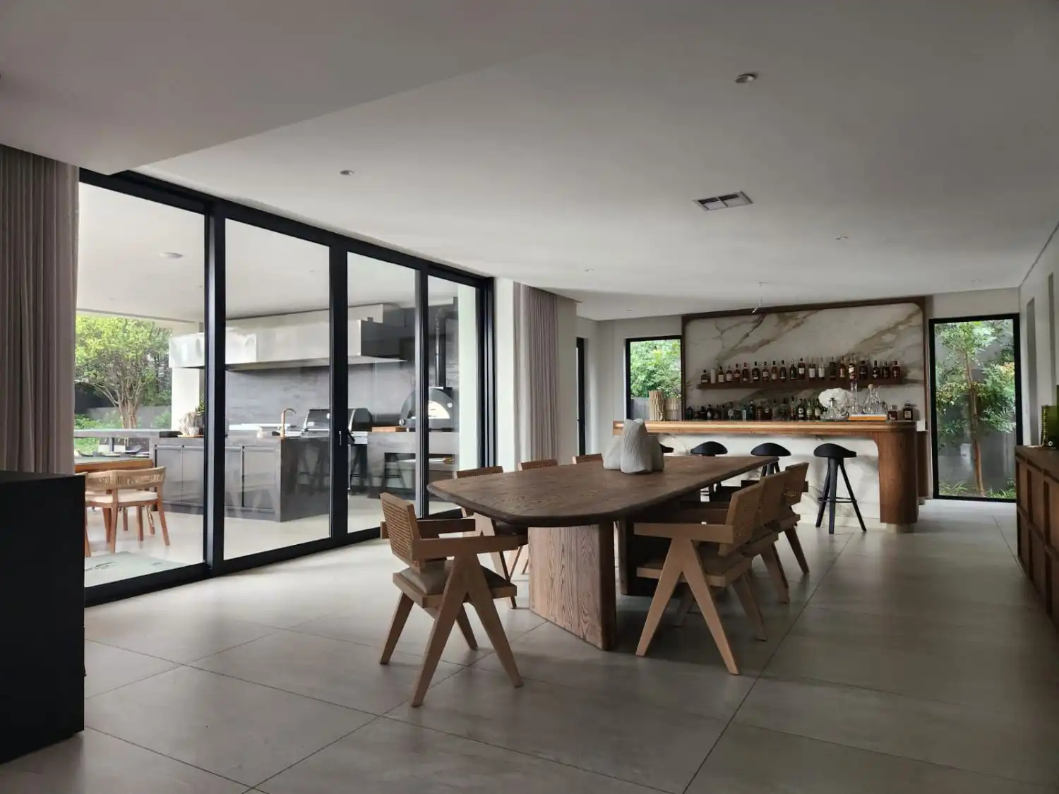 VAGA Series black aluminium sliding doors luxury interior open-plan living dining space