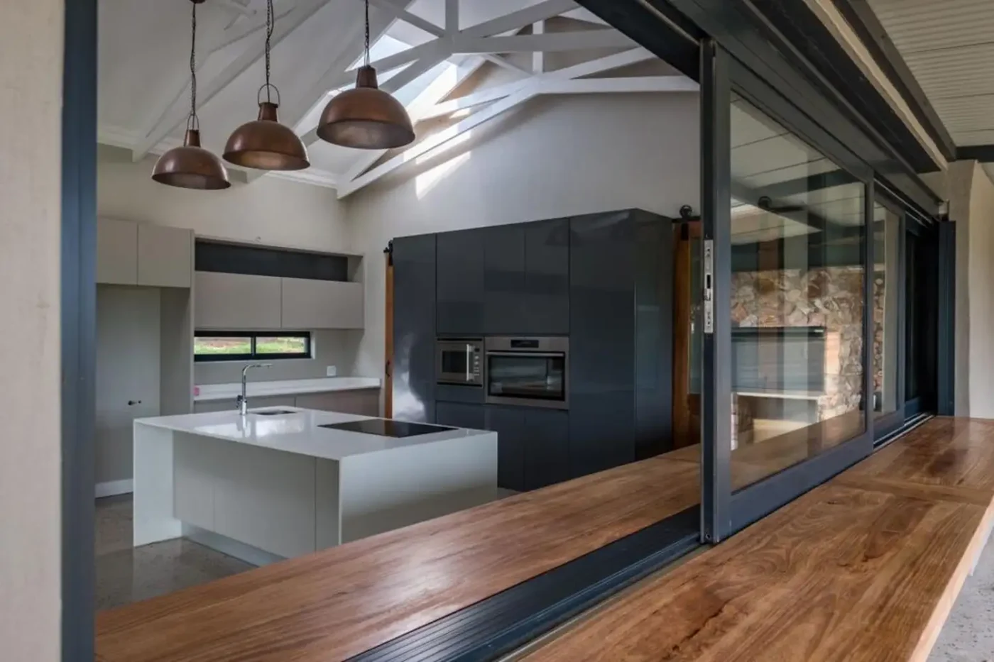 Kitchen with an aluminium stacking window open